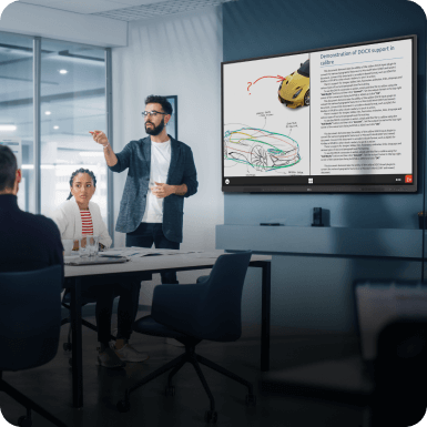 A man in a conference room presenting a project on the Createboard